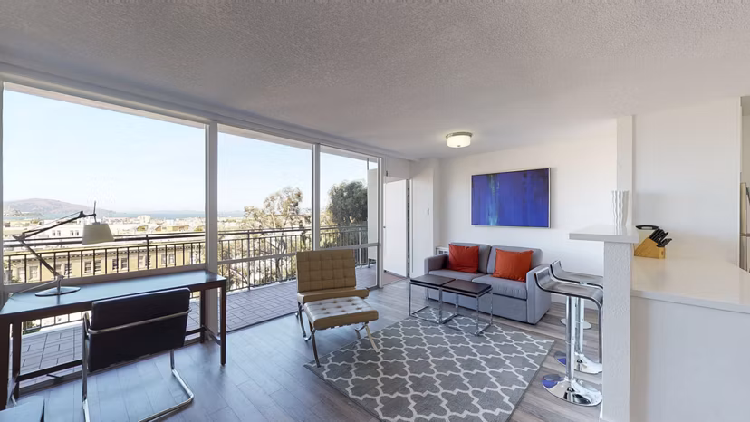 Spacious living room with modern furnishings at Crystal Tower Apartments