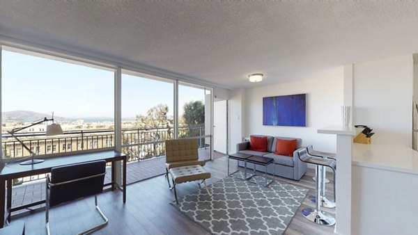 Spacious living room with modern furnishings at Crystal Tower Apartments