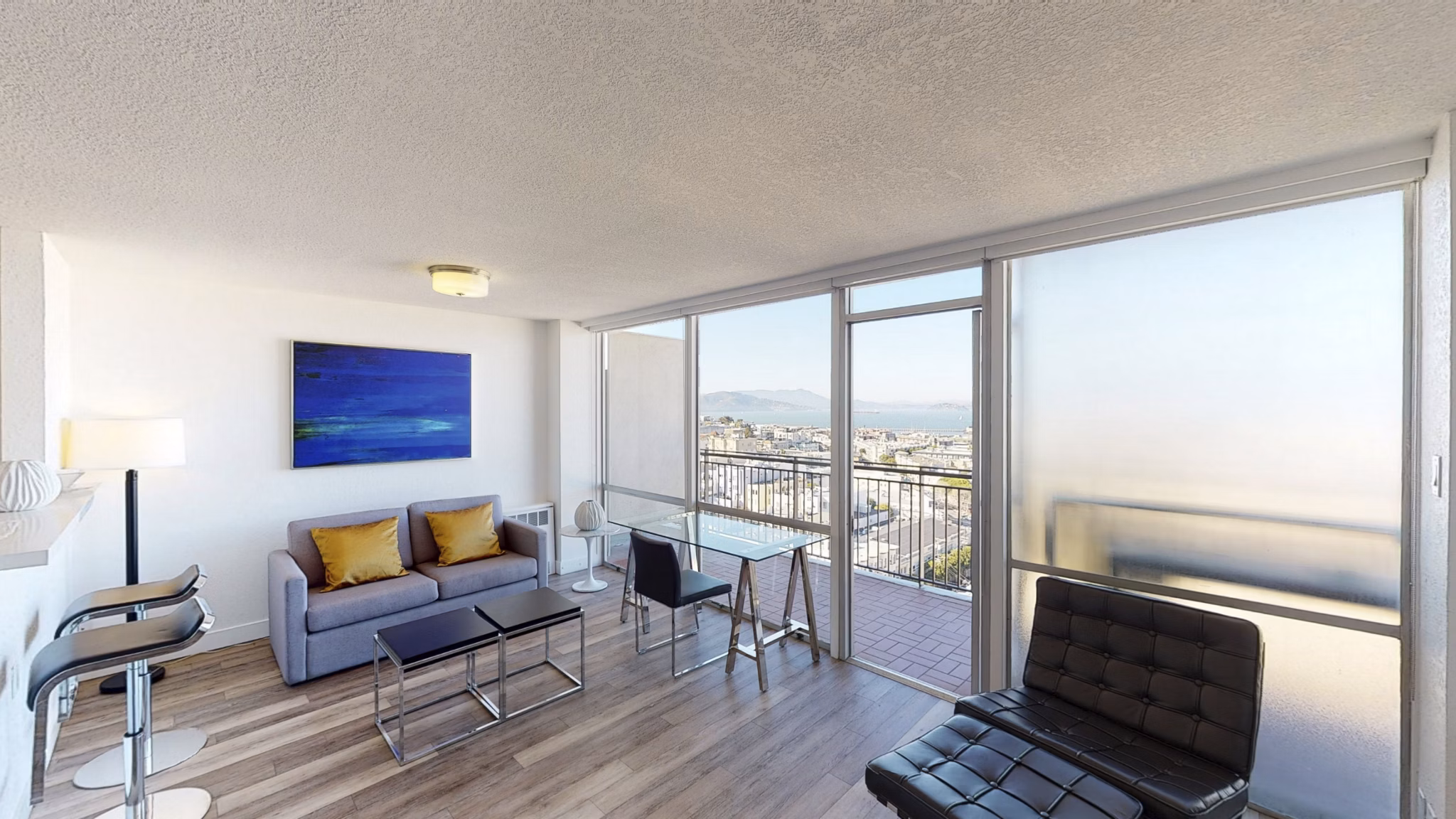 Modern living room with plush seating and natural light in Crystal Tower Apartments, luxury space for comfort and style