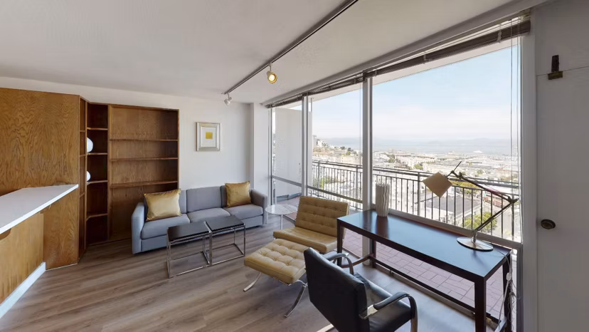 Spacious living room with modern decor at Crystal Tower Apartments, offering luxury living in an elegant setting