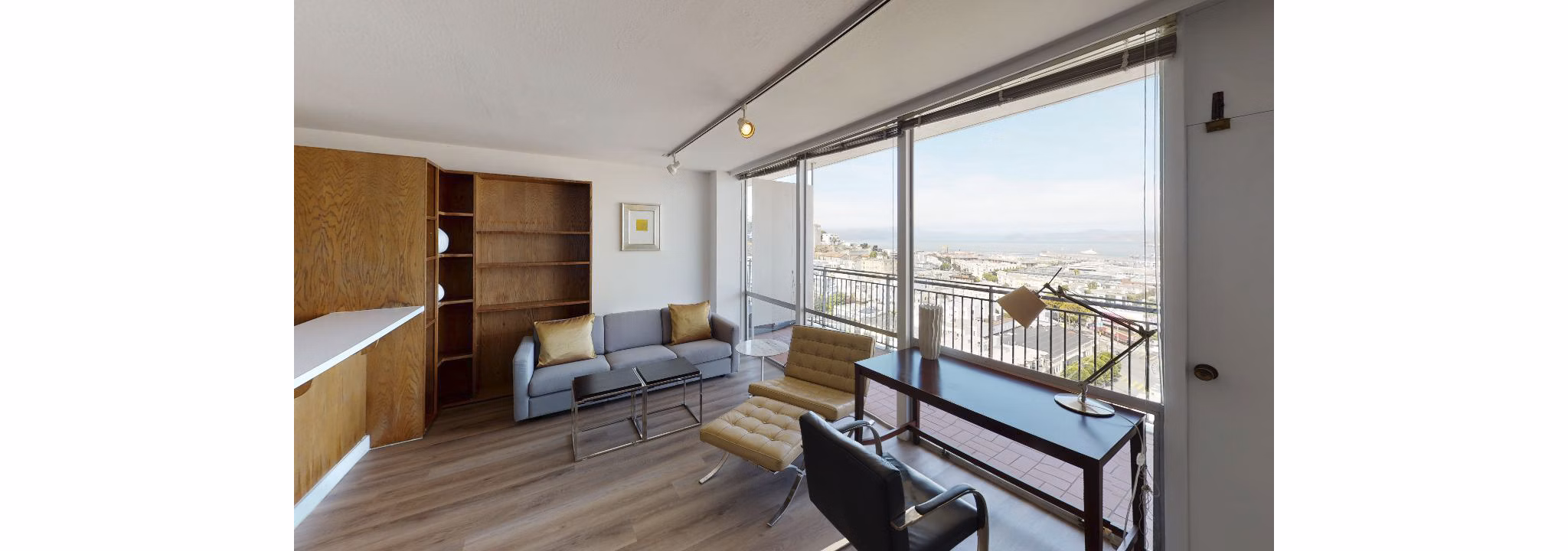 Spacious living room with modern decor at Crystal Tower Apartments, offering luxury living in an elegant setting
