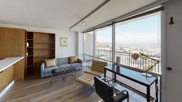 Spacious living room with modern decor at Crystal Tower Apartments, offering luxury living in an elegant setting