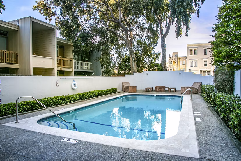 Modern pool with sundeck at Crystal Tower Apartments offering luxury amenities near downtown