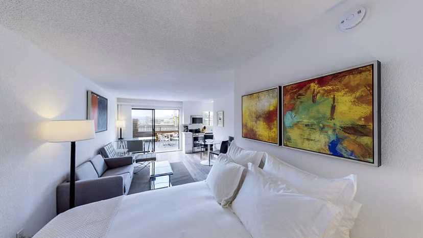 Cozy bedroom with modern decor at Marina Cove Apartments, offering luxury living with spacious layout and natural light