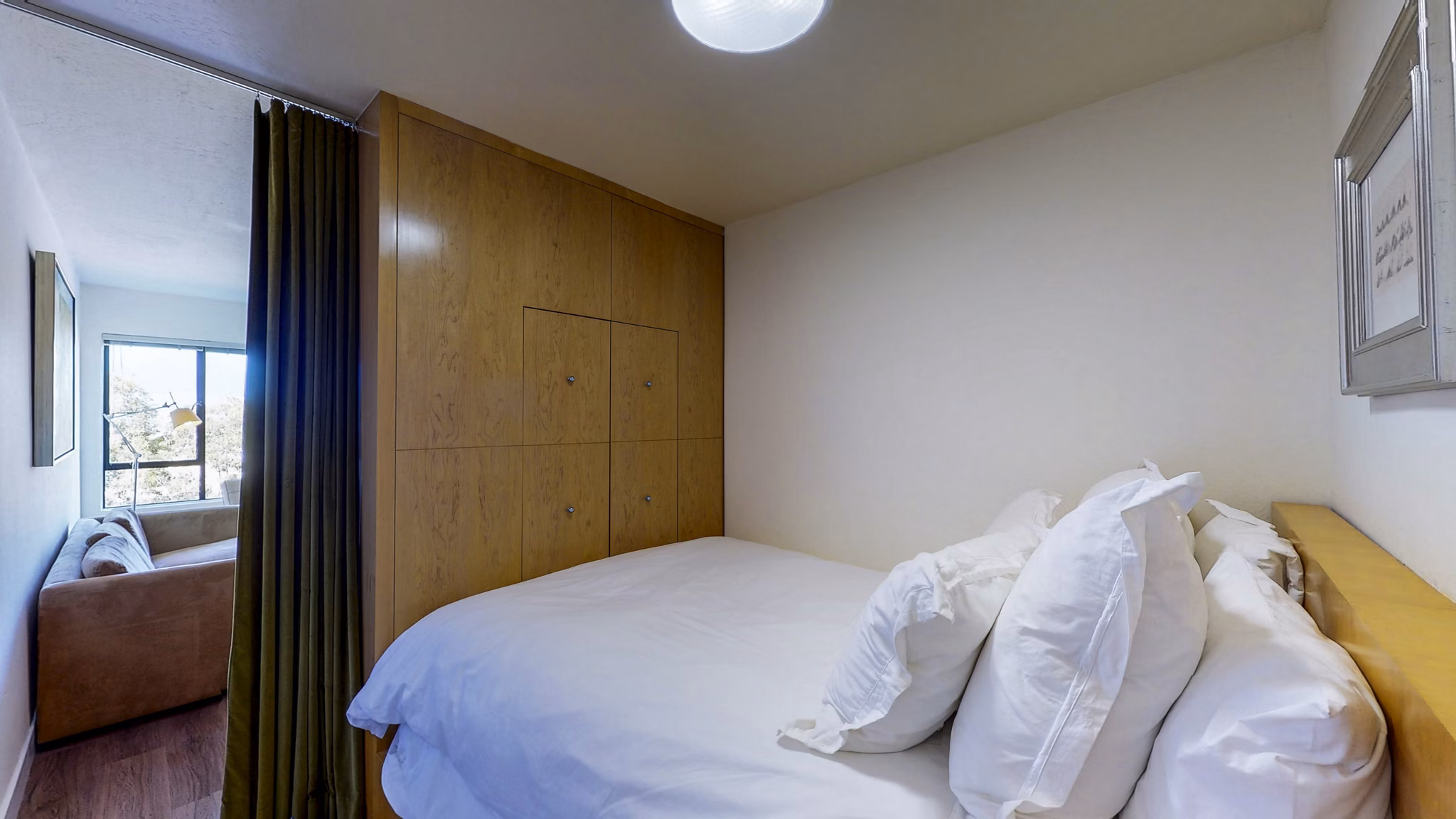 Cozy bedroom with modern furnishings at Marina Cove Apartments, offering luxury living with stylish decor and ample natural light