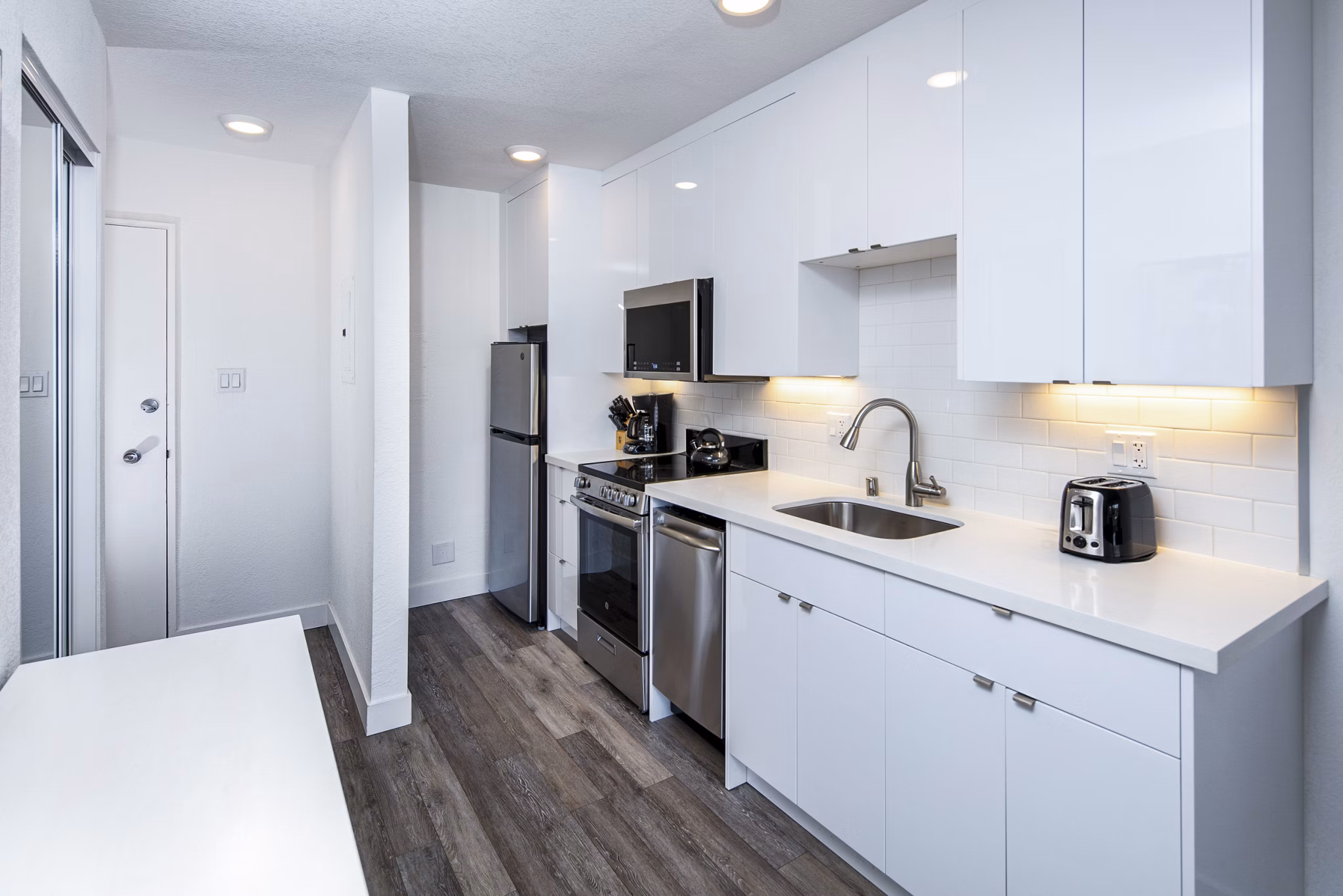 Modern kitchen with stainless steel appliances at Marina Cove Apartments