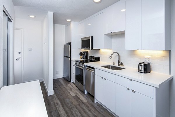 Modern kitchen with stainless steel appliances at Marina Cove Apartments