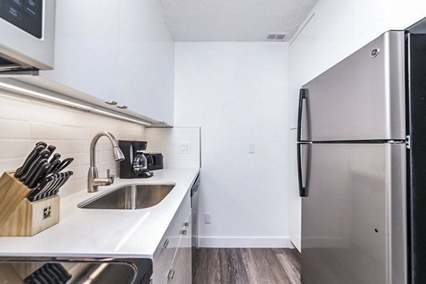 Modern kitchen with stainless steel appliances at Marina Cove Apartments, luxury living on the waterfront