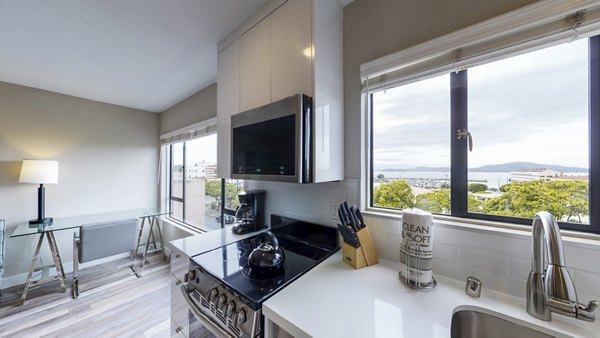Chef-inspired kitchen with stainless steel appliances at Marina Cove Apartments in luxury living community