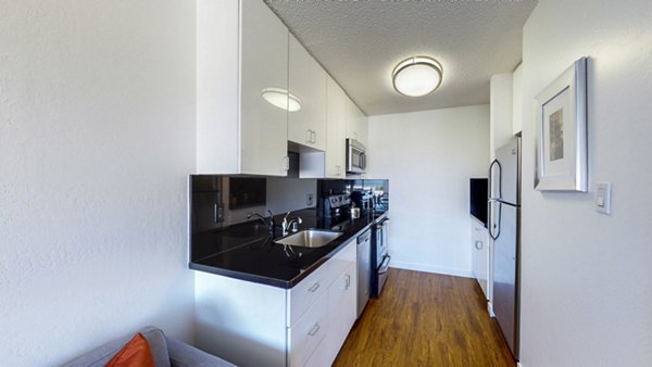 Contemporary kitchen with modern appliances at Marina Cove Apartments