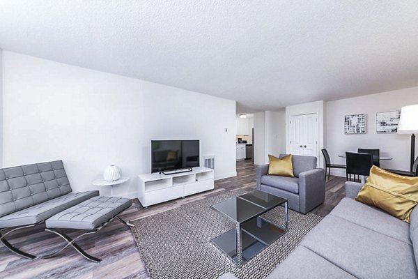 Cozy living room with plush seating and modern decor at Marina Cove Apartments