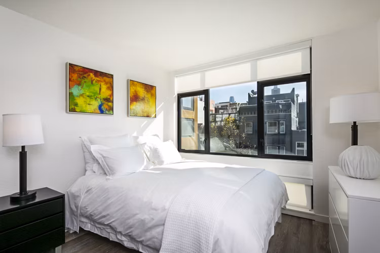 Cozy bedroom with modern decor at Telegraph Hill Apartments