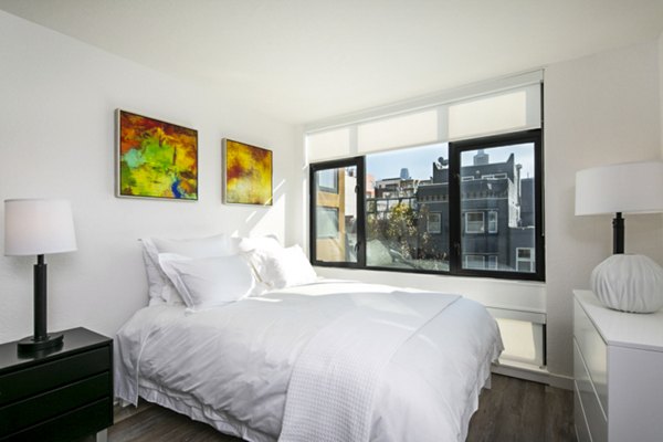 Cozy bedroom with modern decor at Telegraph Hill Apartments