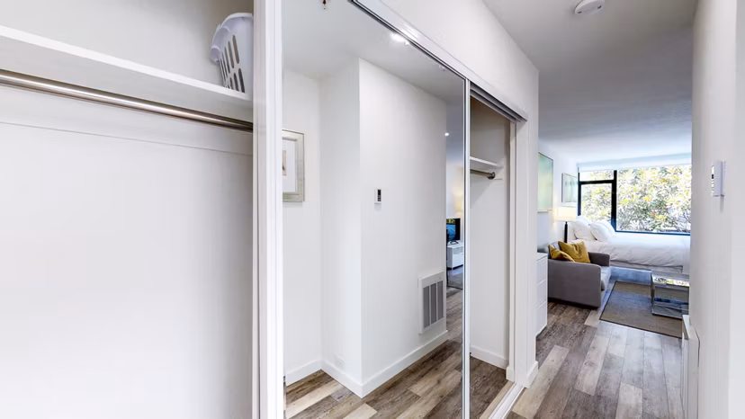 Bedroom closet with custom shelving at Telegraph Hill Apartments, offering luxury storage solutions in our modern San Francisco high-rise
