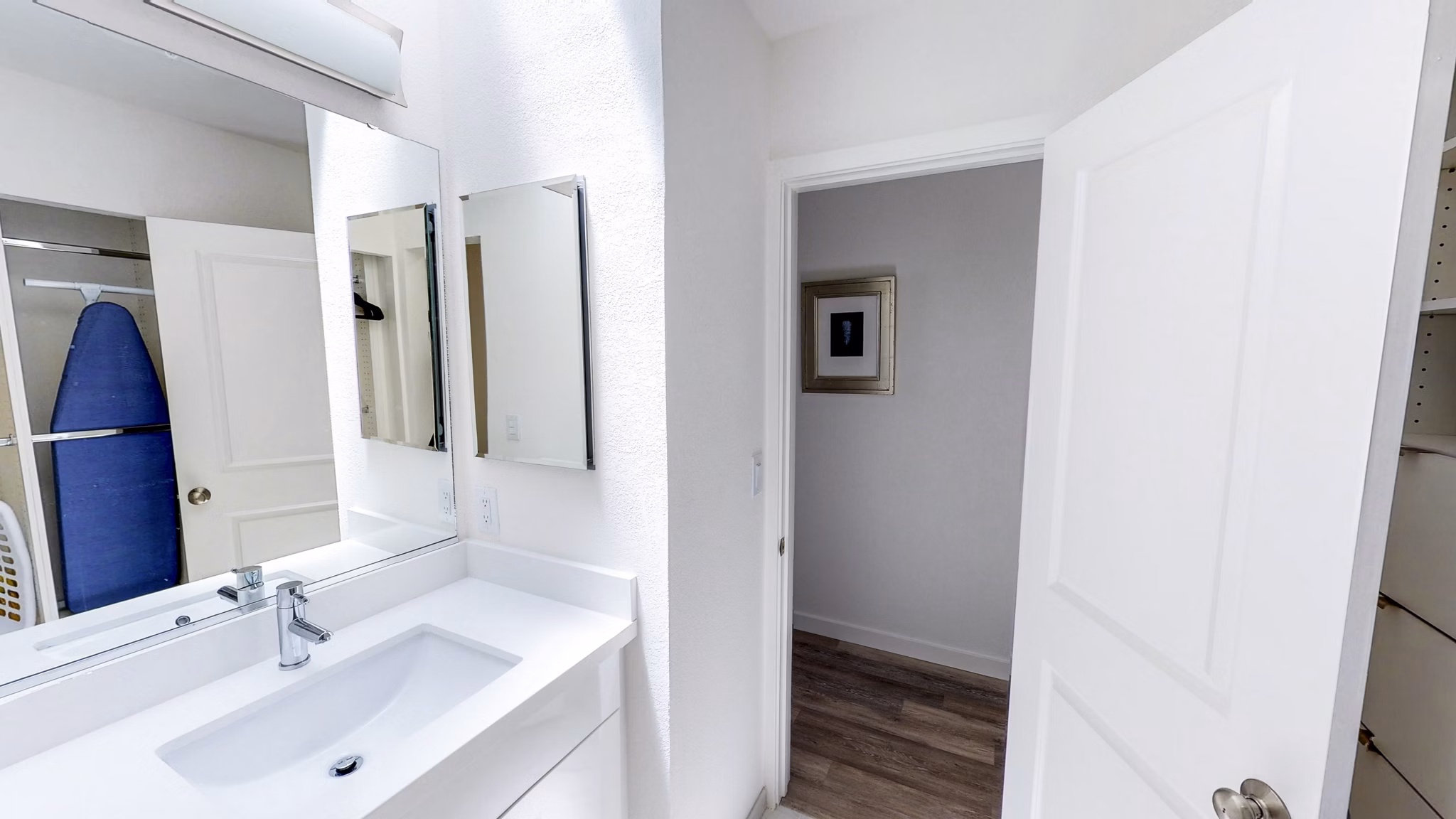 Elegant bathroom with marble countertops and glass shower in Telegraph Hill luxury apartments
