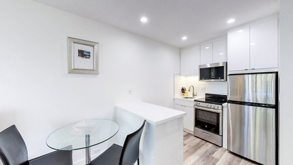 Dining room with modern furnishings at Telegraph Hill Apartments, luxury apartments by Greystar in a prime location