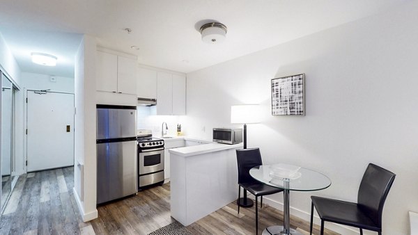 Dining room with elegant lighting and modern furnishings at Telegraph Hill Apartments
