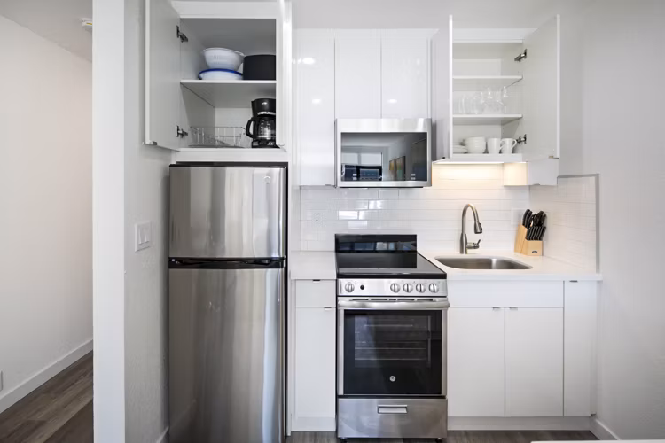 Modern kitchen with stainless steel appliances at Telegraph Hill Apartments, offering luxury living in the heart of the city