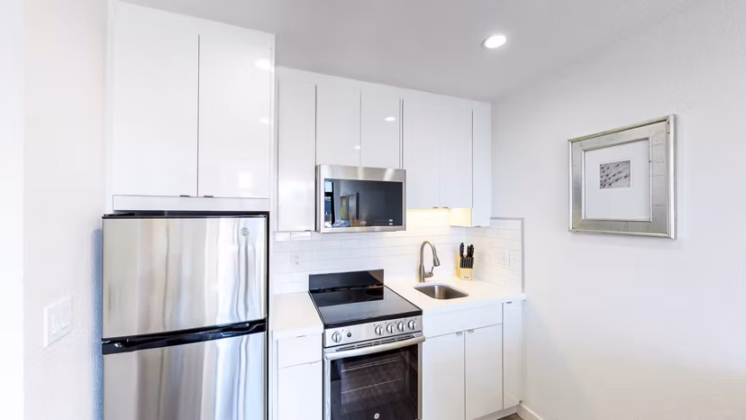 Modern kitchen featuring stainless steel appliances at Telegraph Hill Apartments