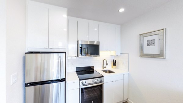 Modern kitchen featuring stainless steel appliances at Telegraph Hill Apartments