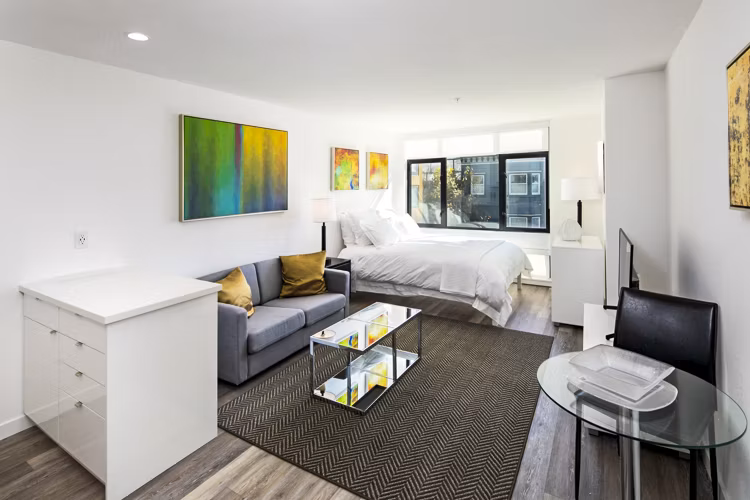 Living room featuring modern decor and spacious layout at Telegraph Hill Apartments