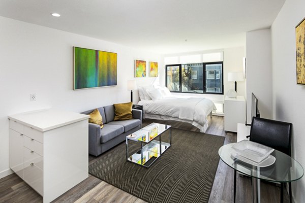 Living room featuring modern decor and spacious layout at Telegraph Hill Apartments