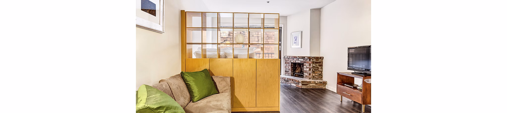 Modern living room with plush seating and large windows at Telegraph Hill Apartments