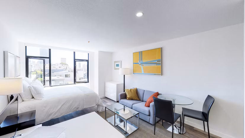 Open-plan living room with city views at Telegraph Hill Apartments
