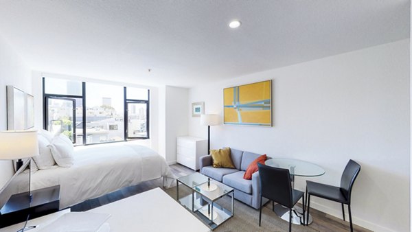 Open-plan living room with city views at Telegraph Hill Apartments