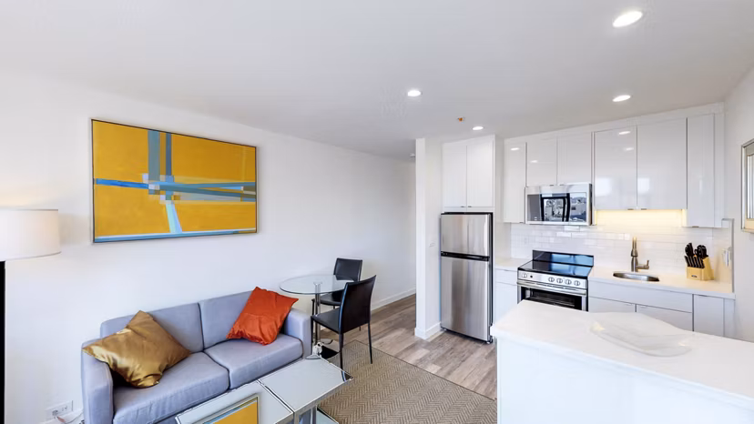 Spacious living room with modern decor and large windows in Telegraph Hill Apartments, San Francisco