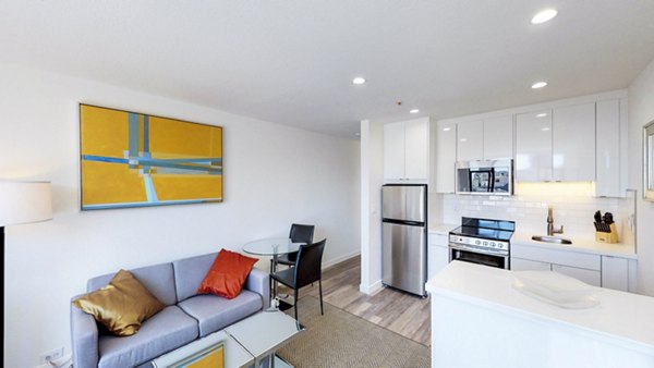 Spacious living room with modern decor and large windows in Telegraph Hill Apartments, San Francisco