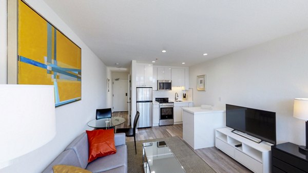Spacious living room with modern furnishings at Telegraph Hill Apartments, luxury living by Greystar