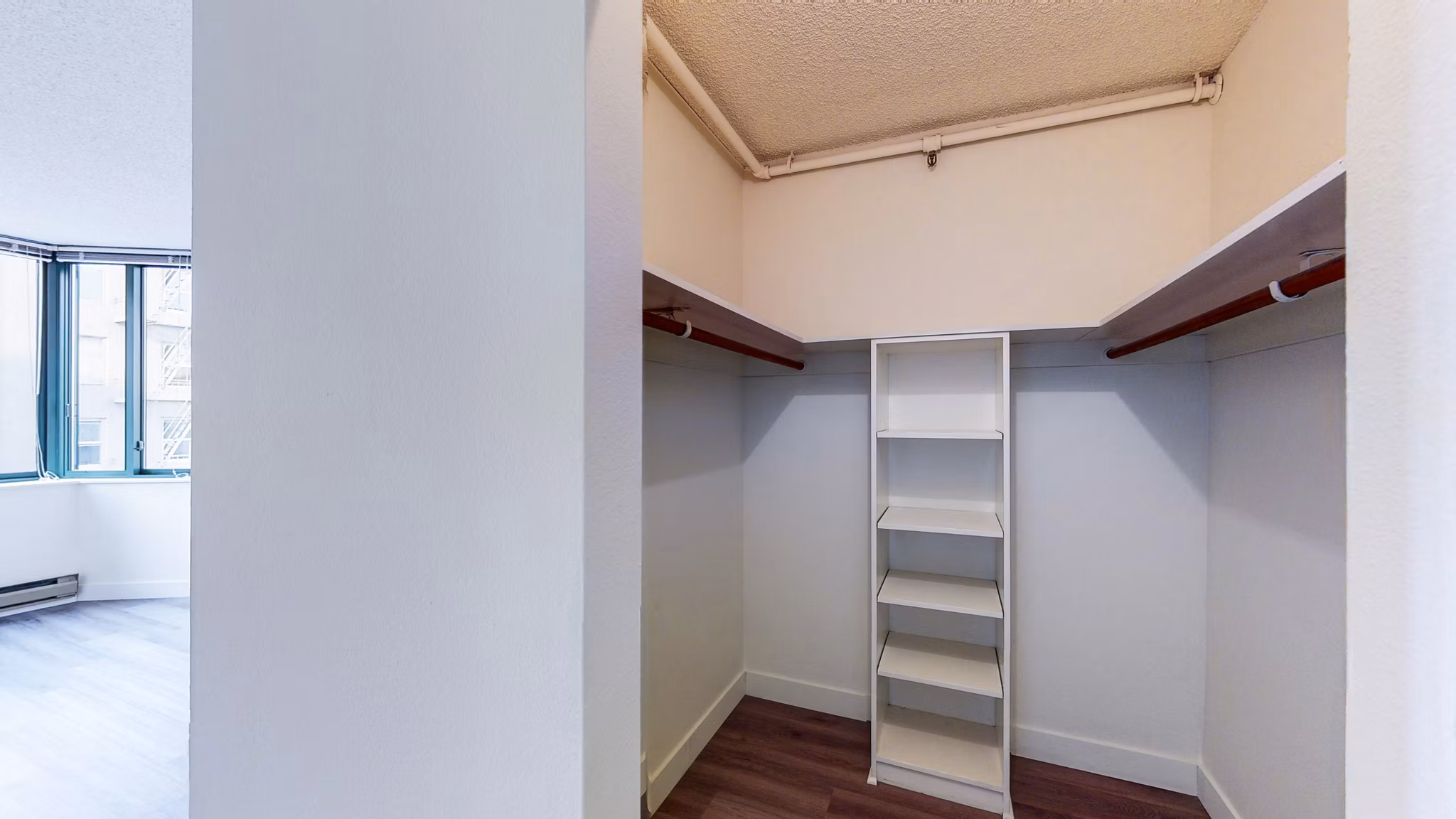 Bedroom closet with ample storage space at Trinity Towers Apartments, San Francisco