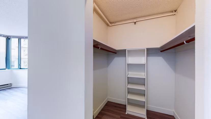 Bedroom closet with ample storage space at Trinity Towers Apartments, San Francisco