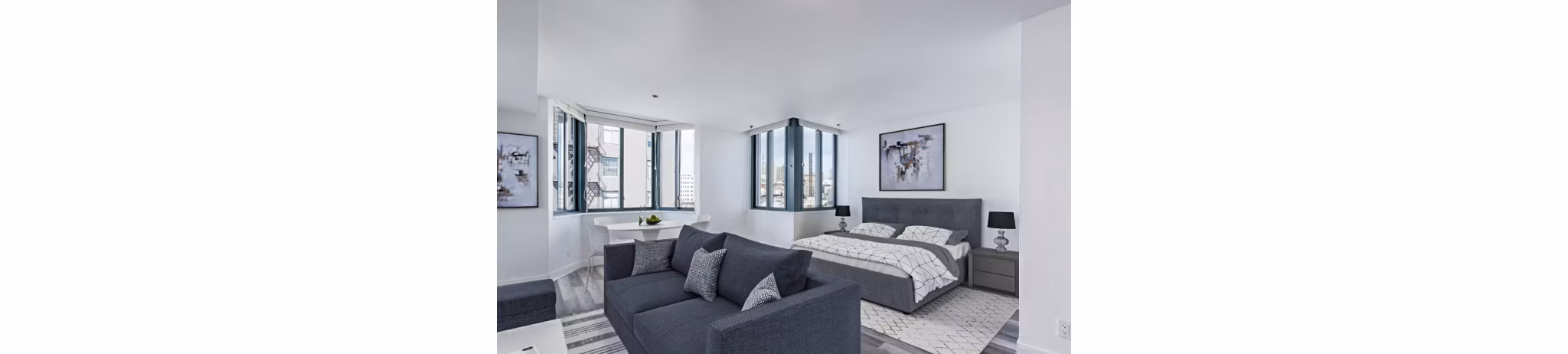 Studio bedroom with modern decor at Trinity Towers Apartments