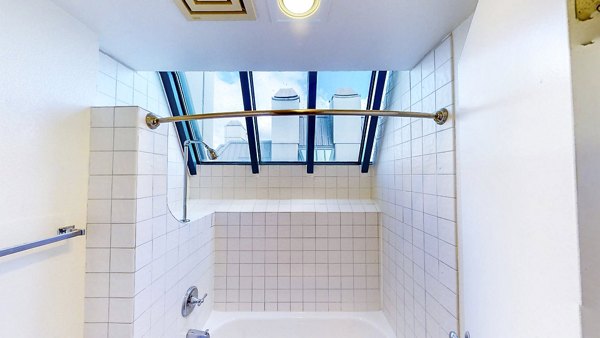 Modern bathroom with sleek fixtures at Trinity Towers Apartments, Greystar luxury community in a prime location