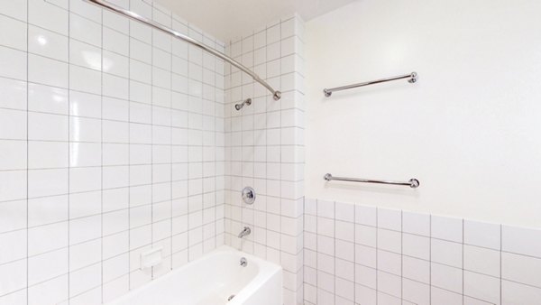 Bathroom with modern fixtures and sleek design at Trinity Towers Apartments