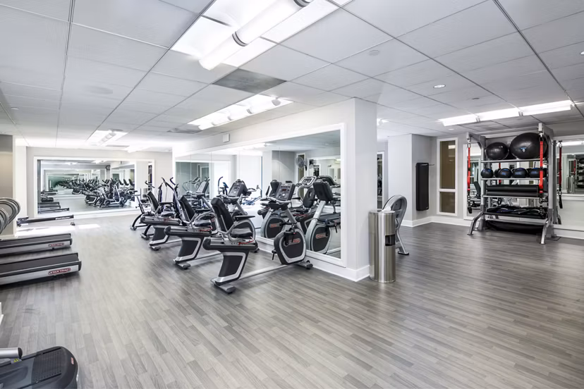 Fitness center with state-of-the-art equipment at Trinity Towers Apartments, offering residents a premium workout experience