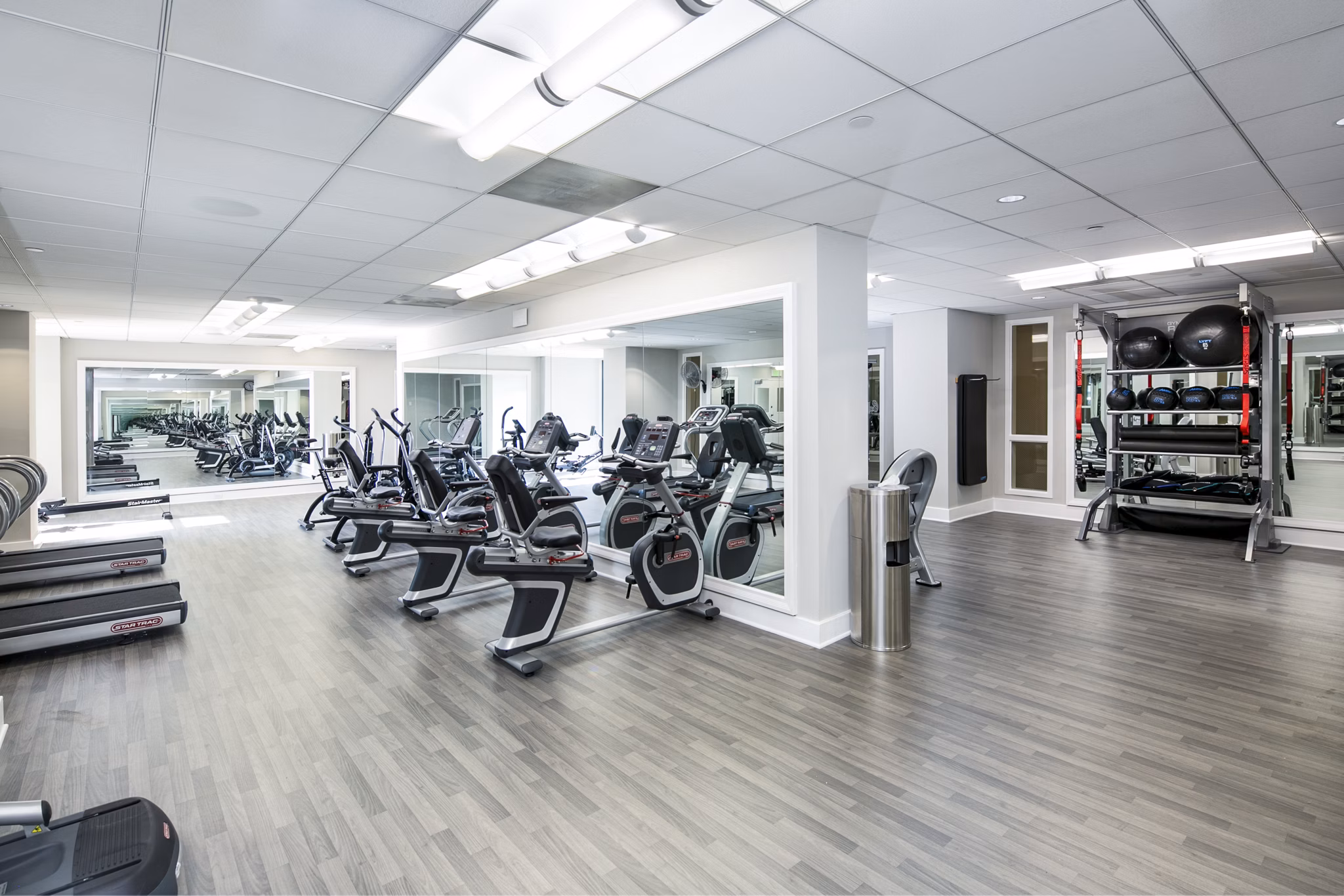 Fitness center with state-of-the-art equipment at Trinity Towers Apartments, offering residents a premium workout experience