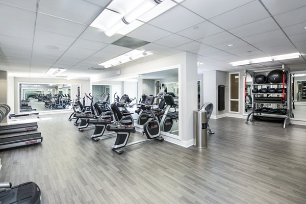 Fitness center with state-of-the-art equipment at Trinity Towers Apartments, offering residents a premium workout experience