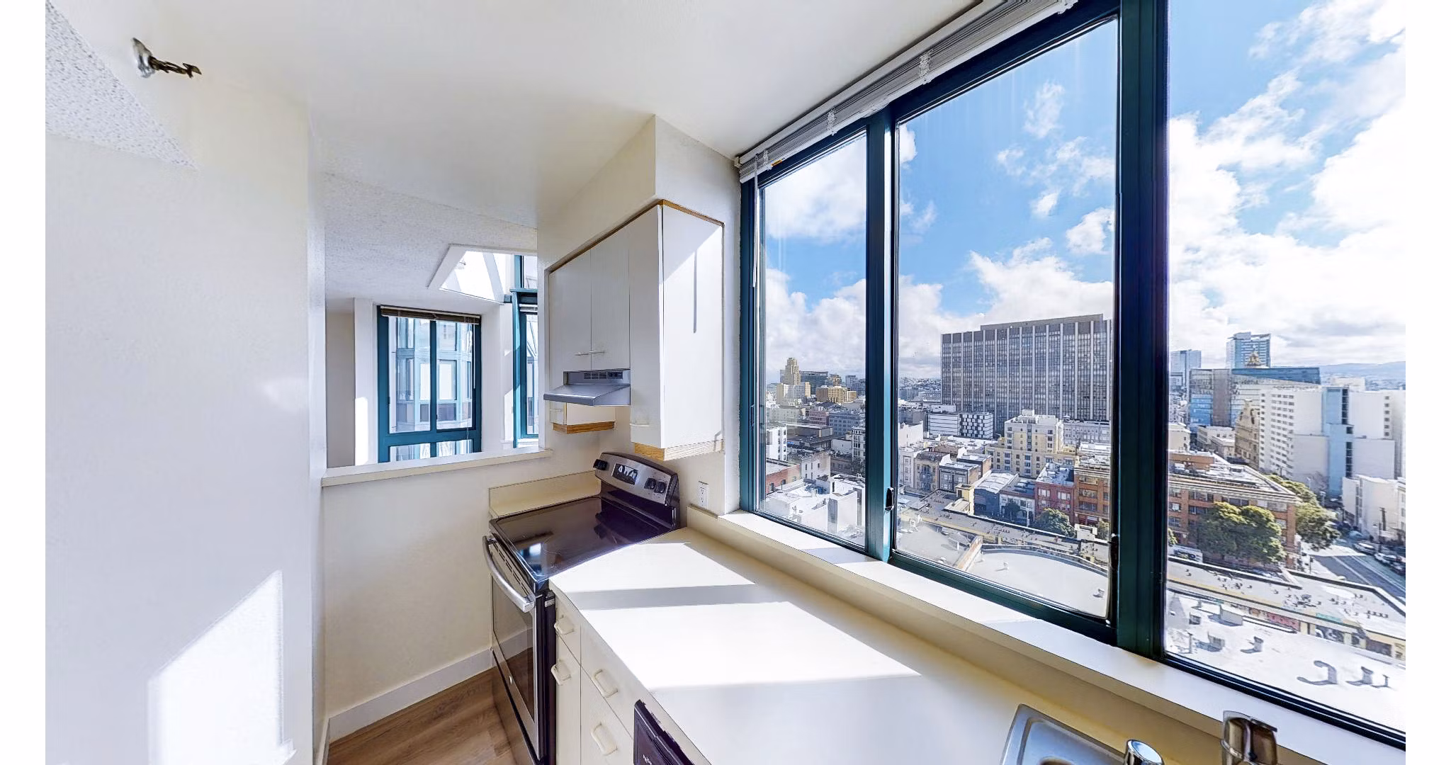 Modern kitchen with stainless steel appliances at Trinity Towers Apartments