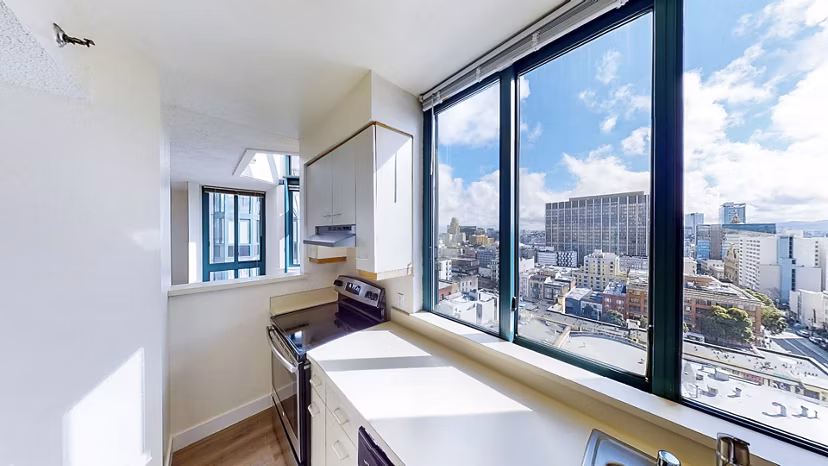 Modern kitchen with stainless steel appliances at Trinity Towers Apartments