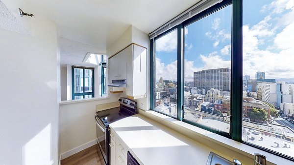 Modern kitchen with stainless steel appliances at Trinity Towers Apartments