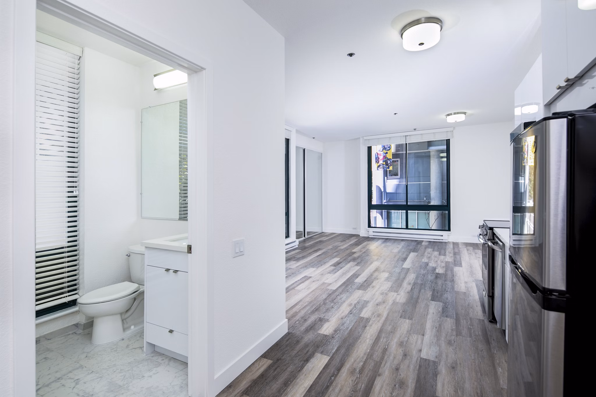 Contemporary kitchen with stainless steel appliances at Trinity Towers Apartments