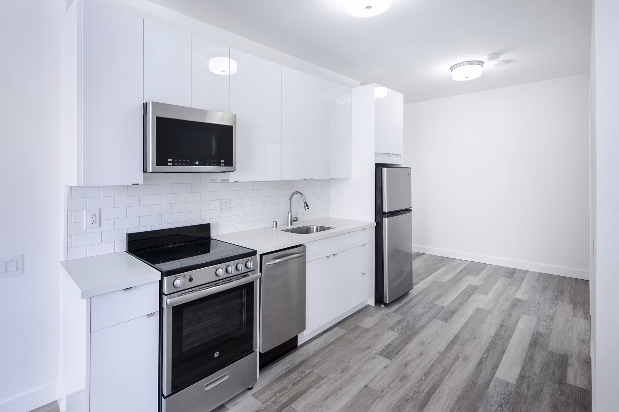 Modern kitchen with stainless steel appliances at Trinity Towers Apartments