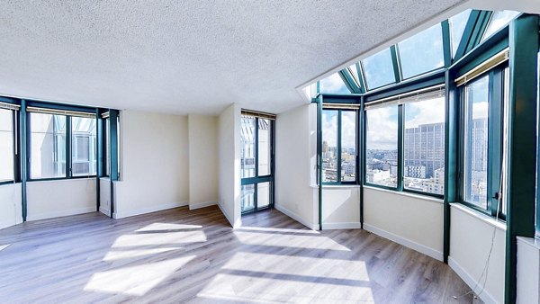 Living room with contemporary decor at Trinity Towers Apartments offering luxury lifestyle