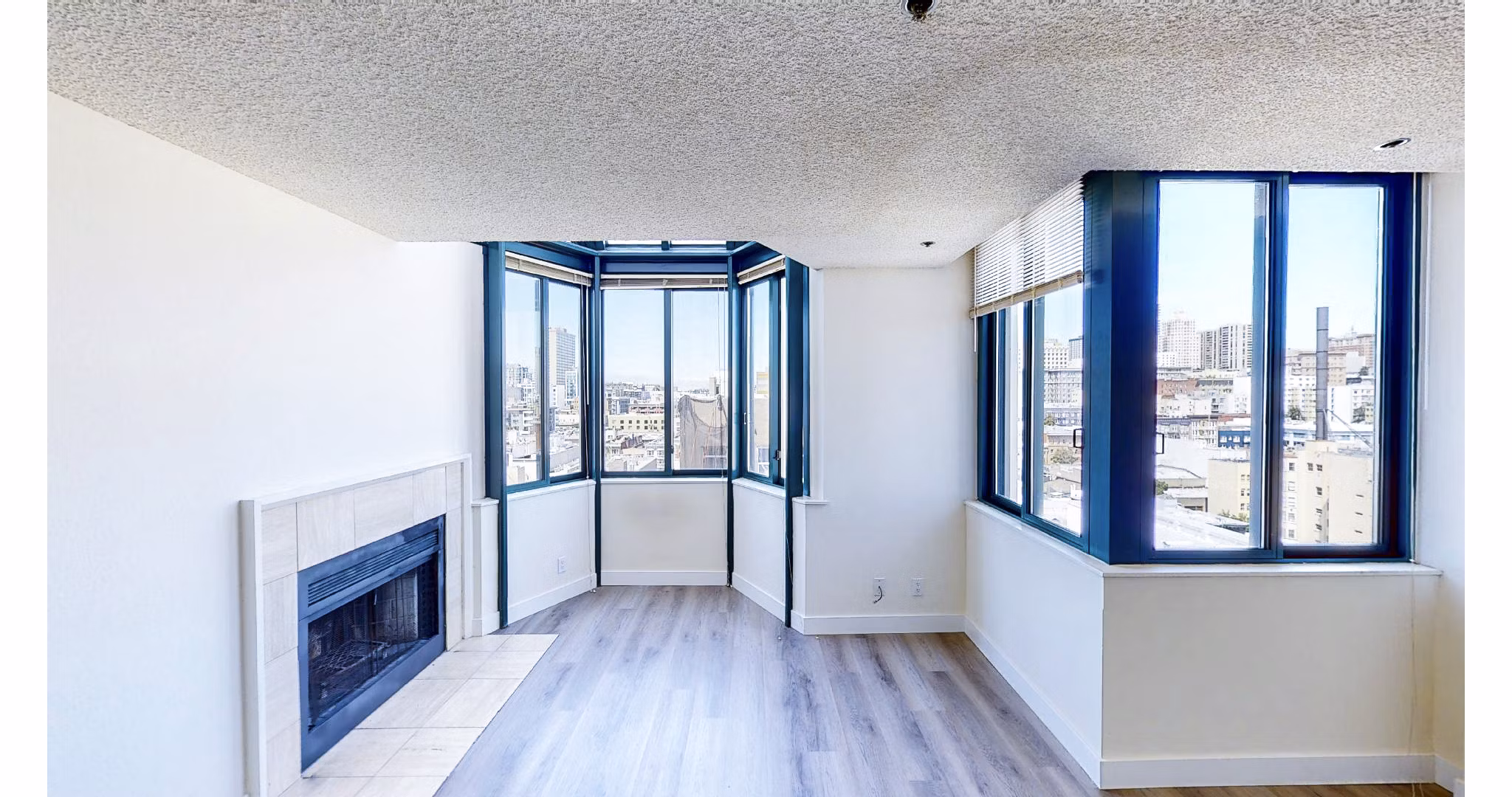 Cozy living room with modern furnishings at Trinity Towers Apartments offering luxury living in the heart of the city