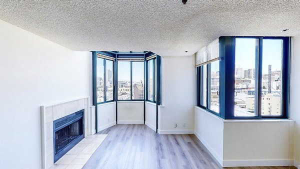 Cozy living room with modern furnishings at Trinity Towers Apartments offering luxury living in the heart of the city
