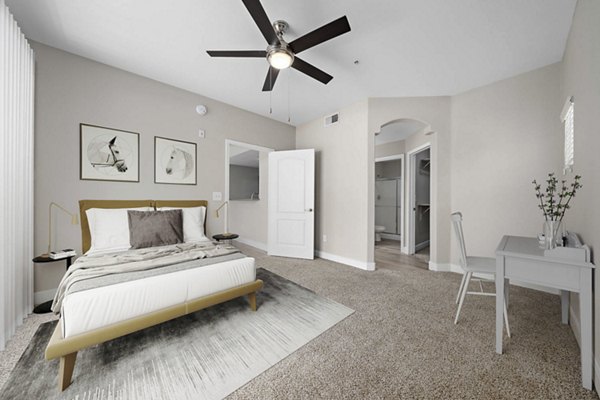 Bedroom featuring modern furnishings and city views at The Met at 3rd and Fillmore Apartments