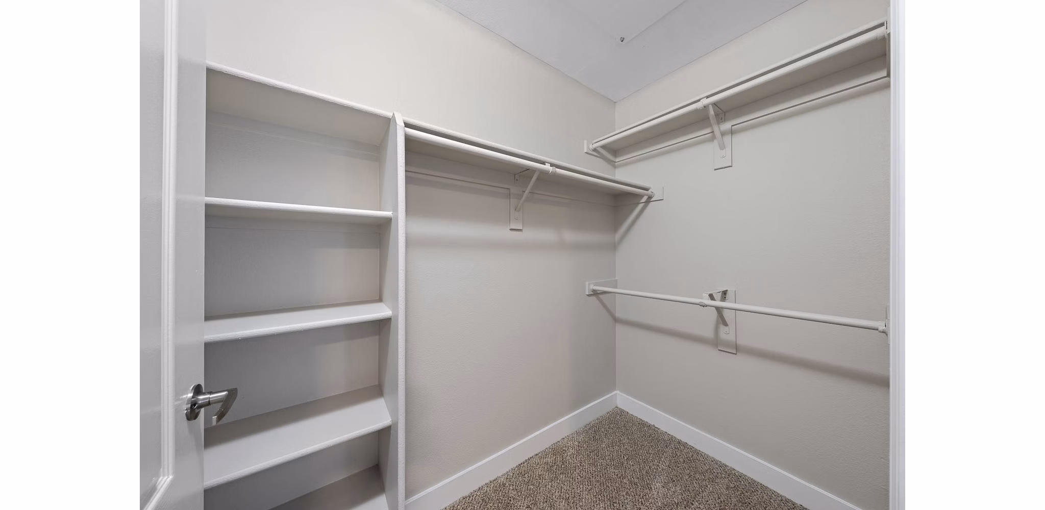 Cozy bedroom with elegant design at The Met at 3rd and Fillmore Apartments